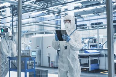 Portrait,Of,A,Female,Worker,Wearing,Full-body,Protective,Coveralls,,Mask