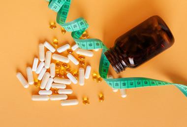 Weight,Loss,Pills,Scattered,From,Bottle,,Diet,Supplements,Capsules,,Obesity