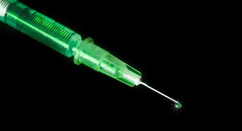 Corona,Virus,Vaccination,-,An,Injection,Needle,Dripping,From,The