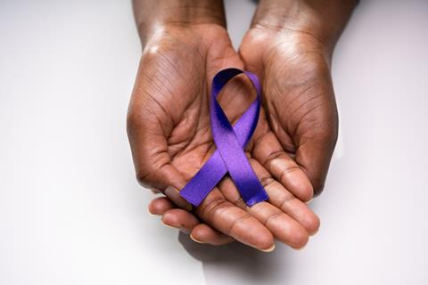 Human,Hand,Showing,Violet,Ribbon,To,Support,Pancreatic,Cancer,Awareness