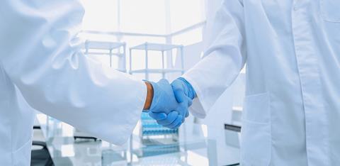 Hand,In,The,Medical,Glove,(handshake)