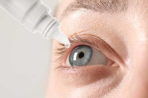 Woman,Applying,Eye,Drops,On,Light,Background,,Closeup