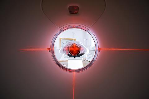 Female,Patient,Undergoing,Ct,Scan,Machine,In,In,Hospital,Room.