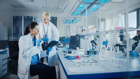 Modern,Medical,Research,Laboratory:,Two,Female,Scientists,Working,Using,Digital